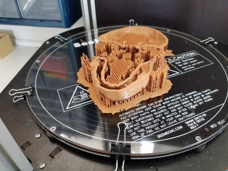 { Caption: First print attempt, showing the breakaway support structure inside and out. Photo by Brother Robot. }