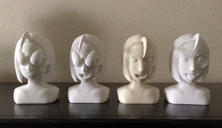 { Group photo of some of the finished busts. From left to right: bust 2, 5, 7, 9. The hair flippy for bust 7 had to be painted to match the ivory color. Luckily, my mom painted a fence in the yard a very similar color. }